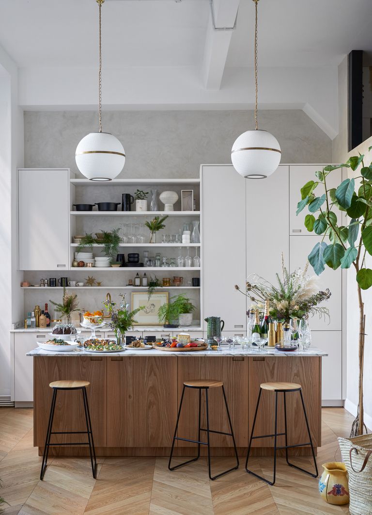 Modern wooden kitchen with globe pendant lighting