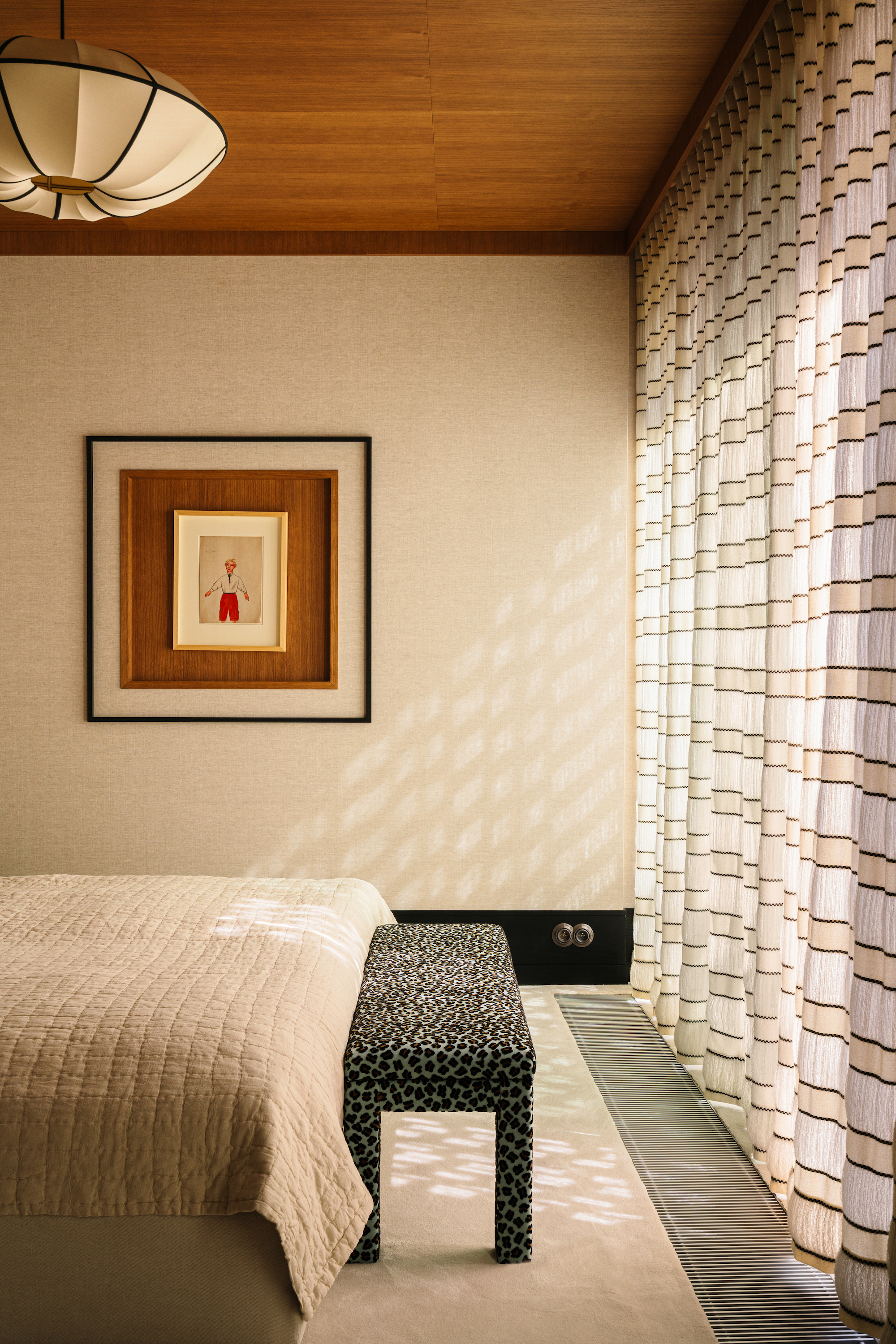bedroom with striped sheer curtains