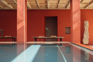 red walls and swimming pool at posada luz