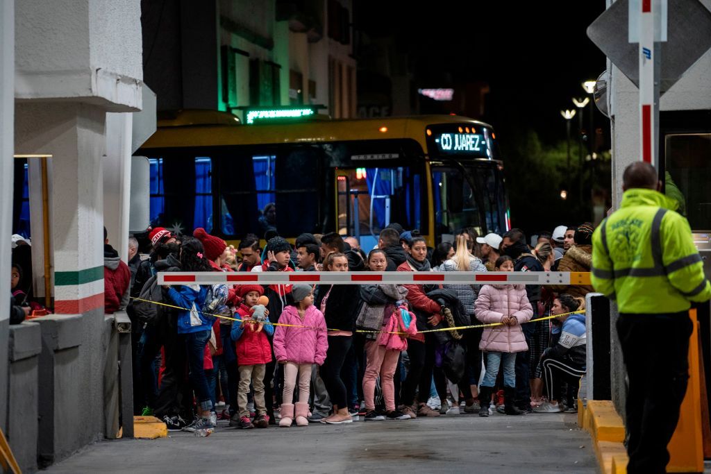 Migrants wait at U.S. border crossing in Mexico