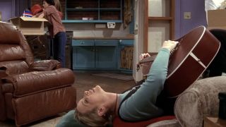 Phoebe upside down with a guitar in Friends