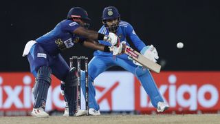 Charith Asalanka (L) plays a shot ahead of the India vs Sri Lanka live stream for the Asia Cup Final 2023