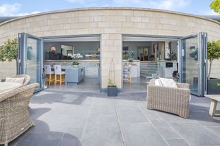 A close-up view of bifold doors leading into the kitchen of this eco home