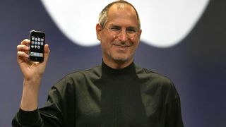 Steve Jobs holding the original iPhone in 2007