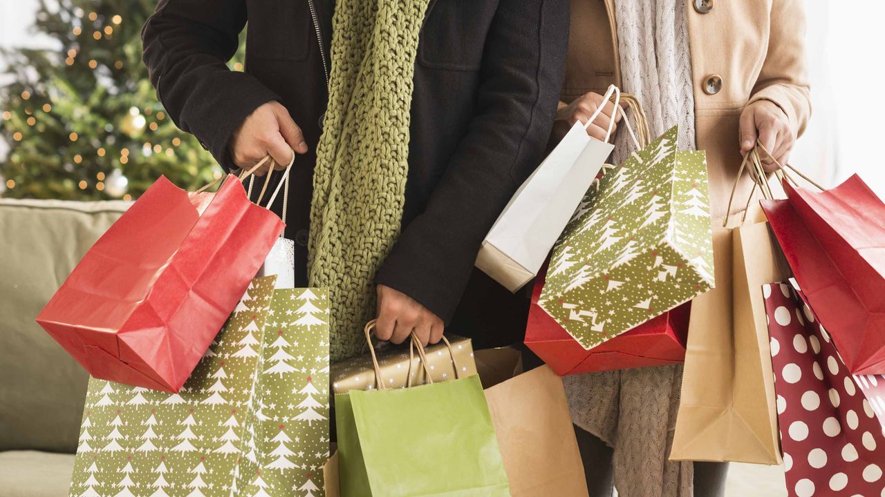 Couple at a store holiday shopping.