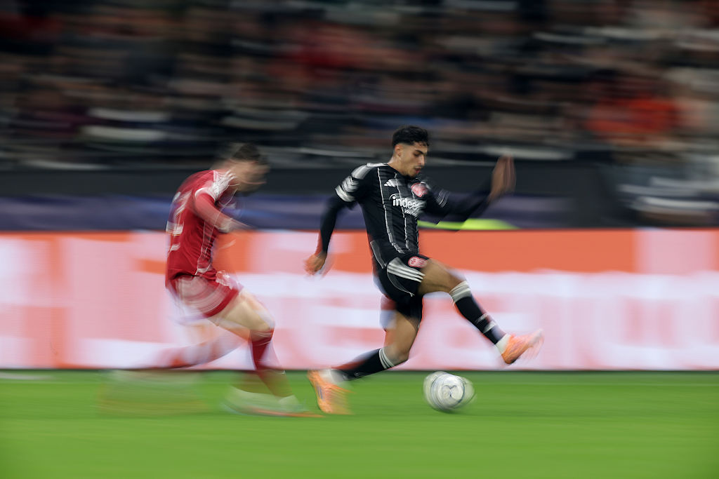 Fares Chaibi of Eintracht Frankfurt is challenged by Conor Bradley of Liverpool during the UEFA Champions League 2025/26 League Phase MD3 match between Eintracht Frankfurt and Liverpool FC at Frankfurt Stadion on October 22, 2025 in Frankfurt am Main, Germany.