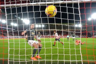 Sheffield United’s David McGoldrick (centre) celebrates scoring his side’s first goal of the game during the Premier League match at Bramall Lane, Sheffield