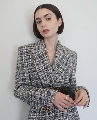 An image of Lily Collins with a 90s bob.