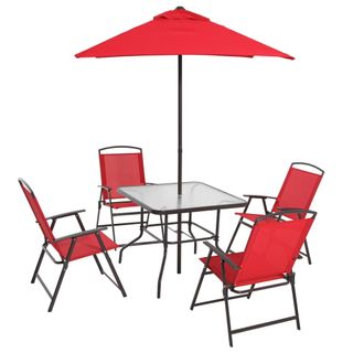 A dining table and chairs in red with a matching red umbrella