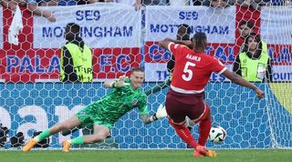 Jordan Pickford saves Manuel Akanji's penalty as England beat Switzerland in a shootout in their Euro 2024 quater-final