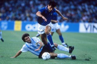 Argentina's Oscar Ruggeri slides in to tackle Italy's Paolo Maldini at the 1990 World Cup.