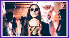 woman in skeleton halloween costume holding fake skeleton head at a halloween party