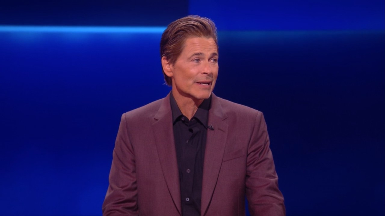 Rob Lowe smiling while talking on The Floor.