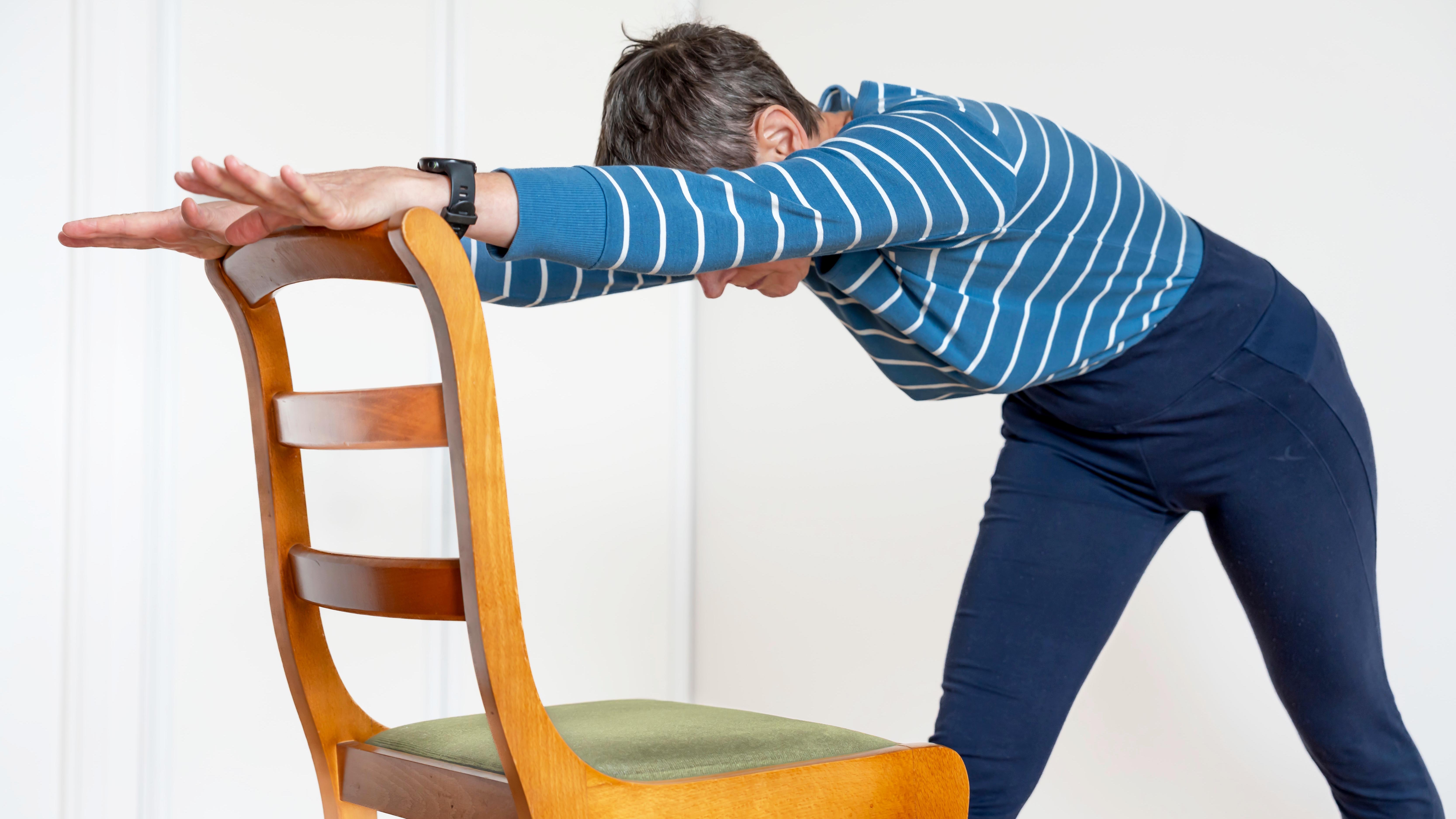 a woman doing a chair workout