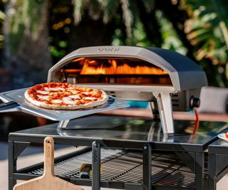 Ooni Koda on a pizza oven table