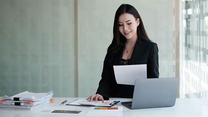 Businesswoman with paperwork