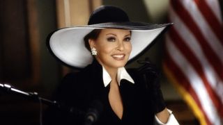 A well-dressed Raquel Welch takes the stand in Legally Blonde.