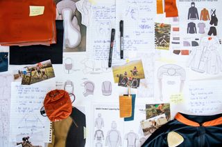 A Rab Cinder mood board with lots on images of bike riding, fabric samples and design drawings