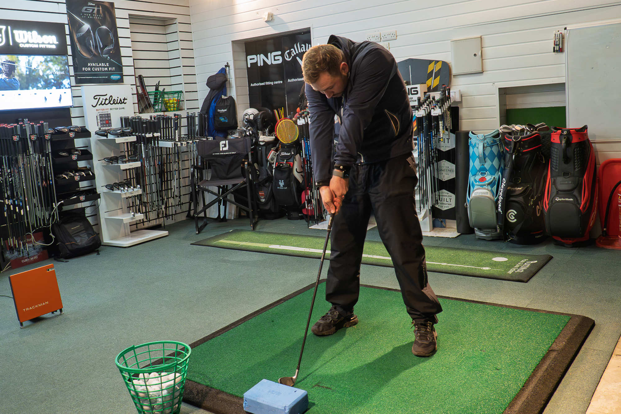 Joshua Mayo demonstrating the 'hunchback' position that Rob Spedding gets into when tense of the golf ball at setup