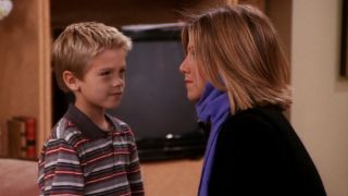 Cole Sprouse as Ben Gellar and Jennifer Aniston as Rachel Green on Friends.