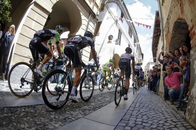 Riders head to the start of stage 14