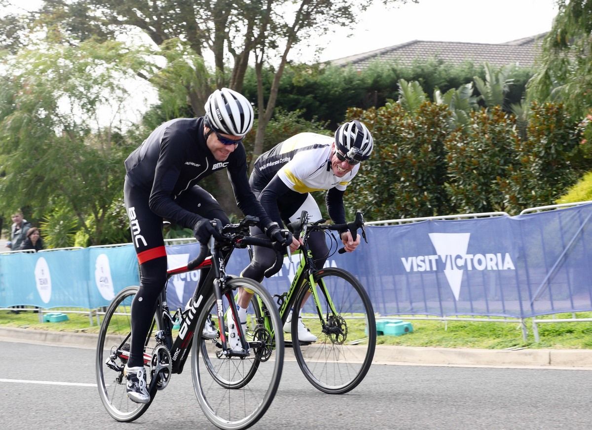 Phil Anderson and Cadel Evans race up Challambra before the race launch