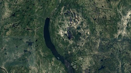 Image shows a satellite picture from Google Earth showing a recently discovered meteor impact crater.