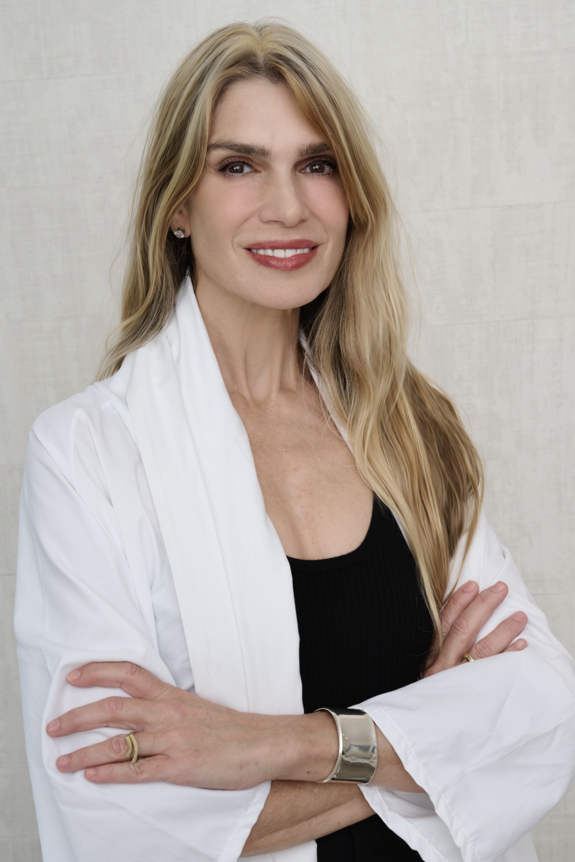 a blonde woman in a white lab coat