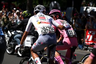 Simon Yates (right) begins stage 21 in the pink jersey, alongside former leader Isaac del Toro now in the white young rider jersey at 2025 Giro d'Italia