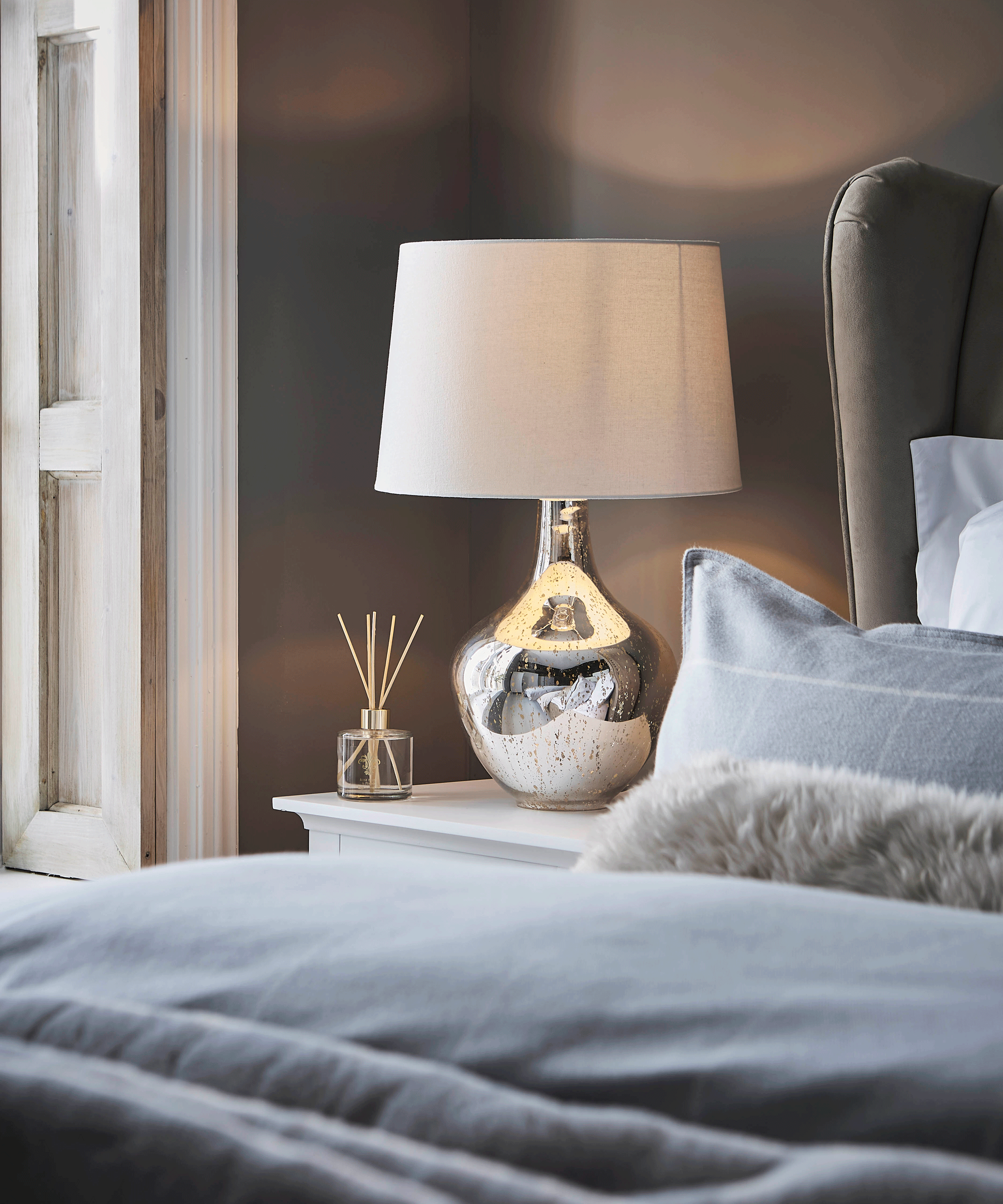 Dunelm metallic lamp in bedroom
