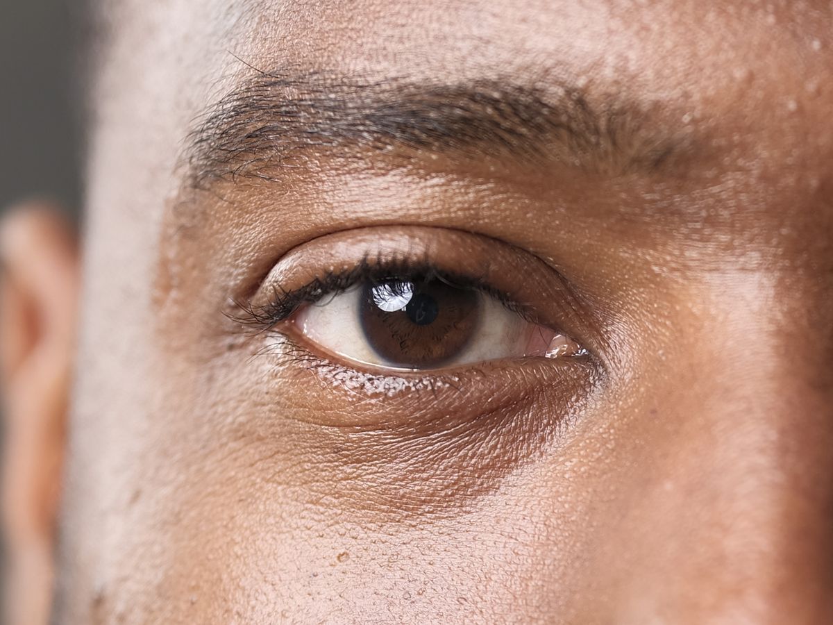 Studio portrait closeup of model's eye and the focus is on the iris