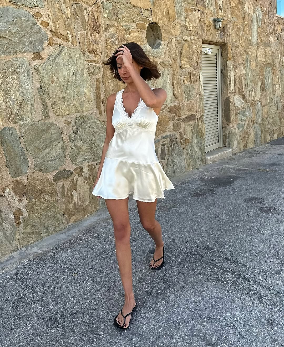 An image of a woman wearing timeless summer outfit