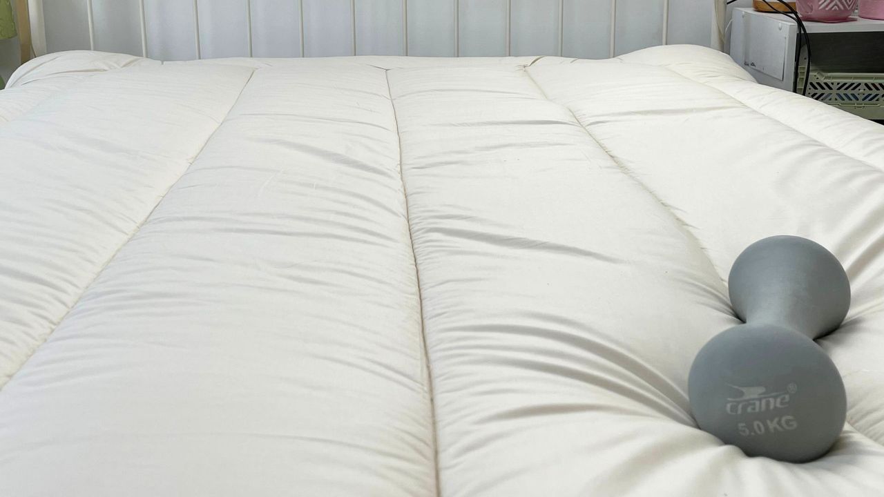 woolroom mattress topper with 5KG weight on top
