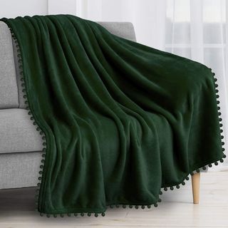 Green pom pom throw blanket from Amazon