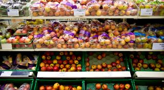 Waitrose supermarket shelves apples pears and other fruit