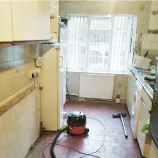 kitchen room with window and stone tiles flooring