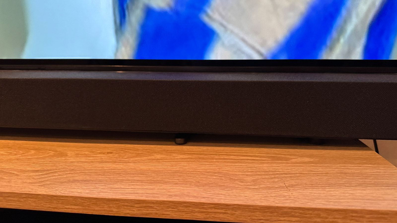 Sony Bravia Theater Bar 8 soundbar with feet attached and sitting over the feet of the Sony Bravia 8 OLED TV