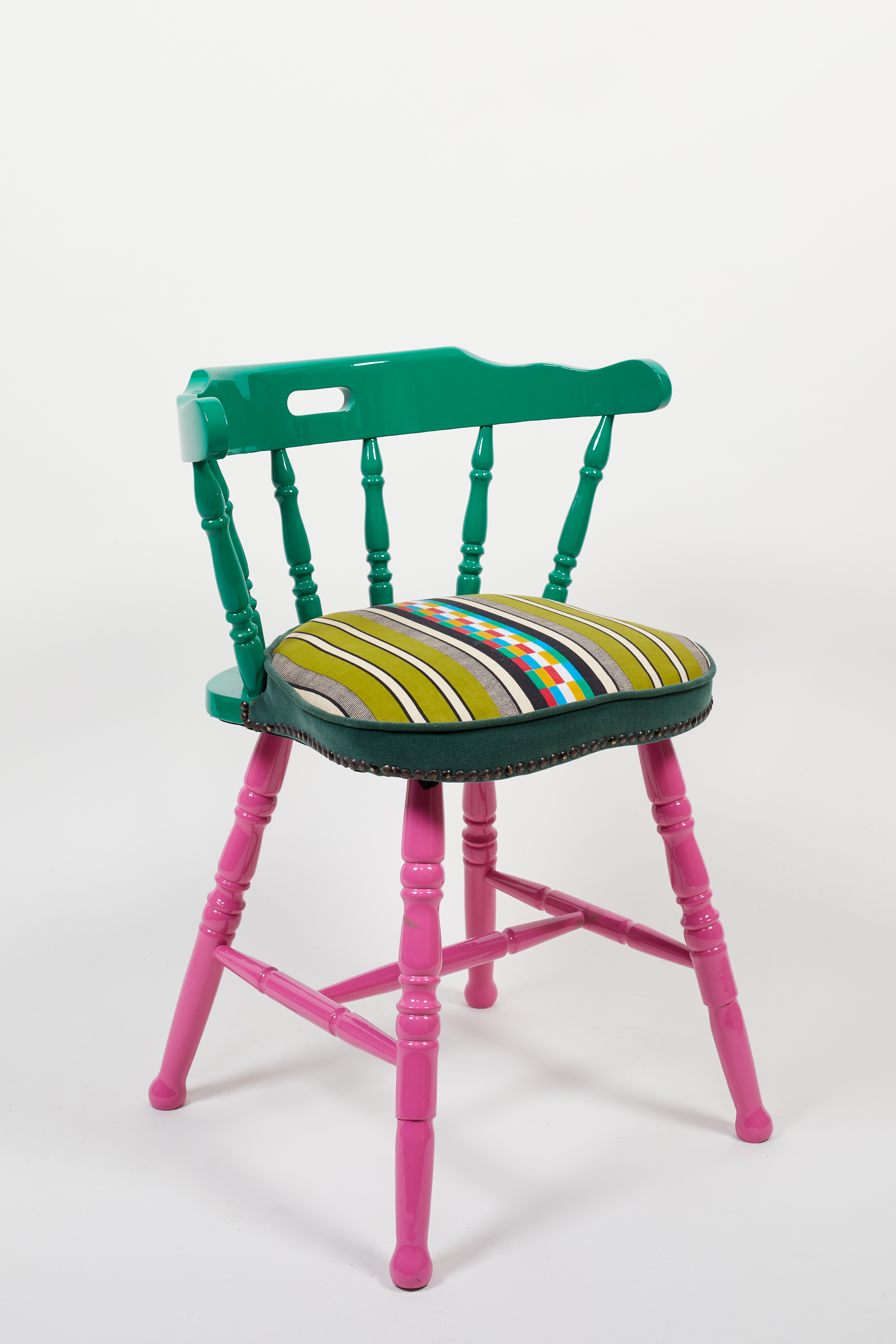 Yinka Illori chair with pink legs and green top