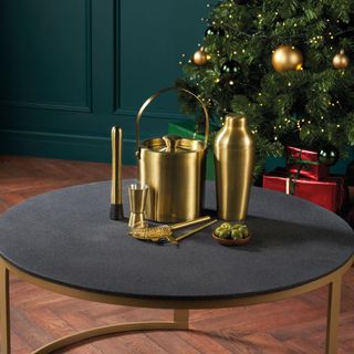 gold cocktail shaker set on table