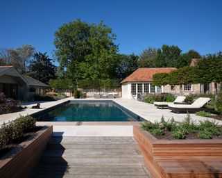 pool patio designed by Your Garden Design including Buscot limestone in an etched finish from Artisans of Devizes