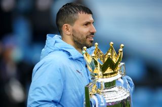 Sergio Aguero holds the Premier League trophy after Manchester City's 2020/21 title win