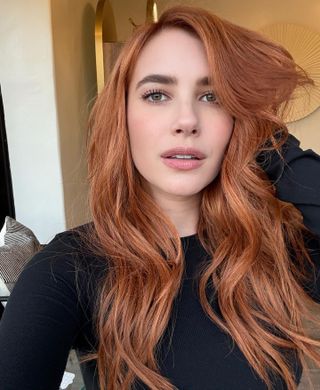 A picture of Emma Roberts with copper hair.