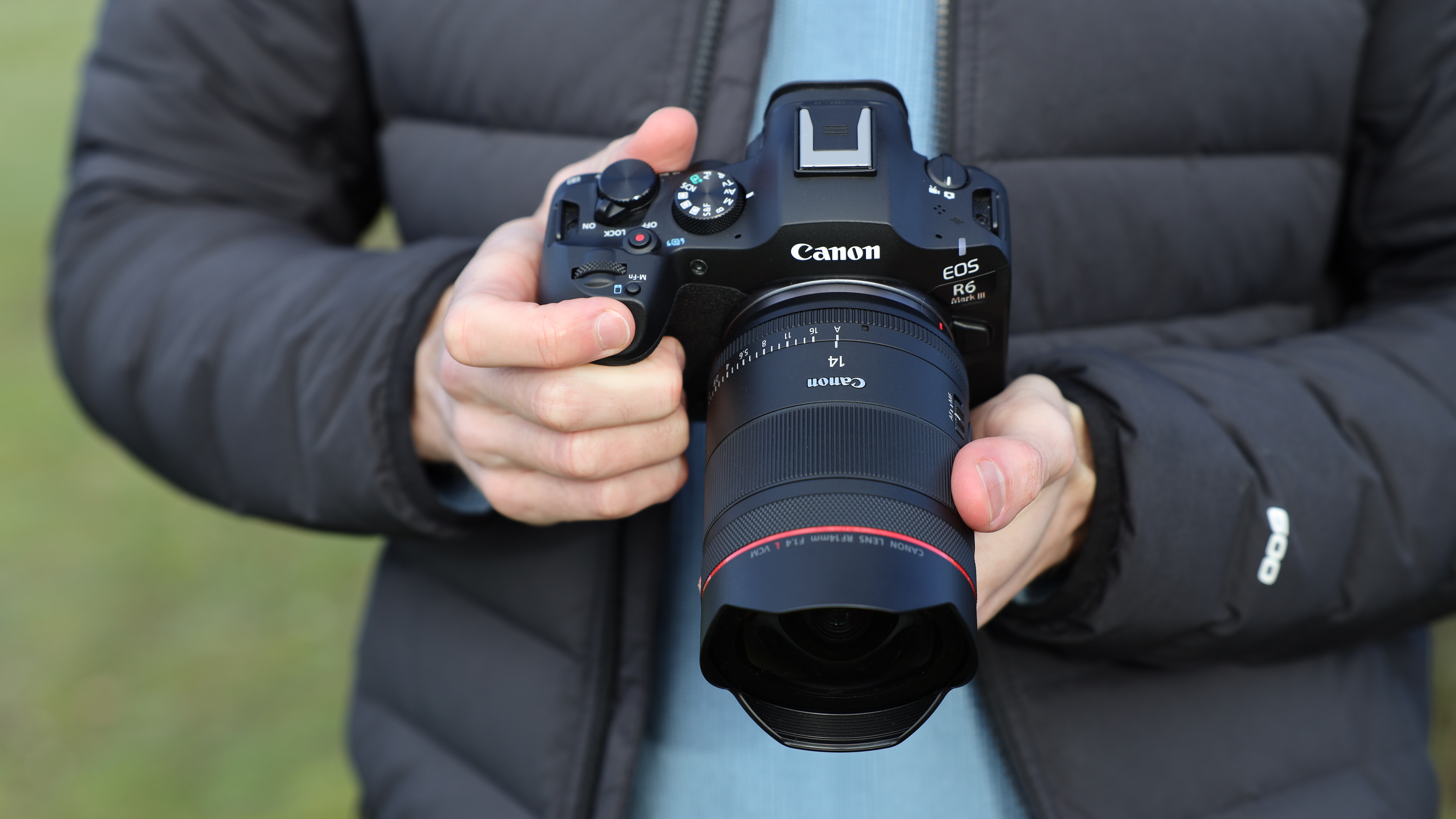Canon EOS R6 Mark III camera with Canon RF 14mm f/1.4L VCM lens attached held in a pair of hands