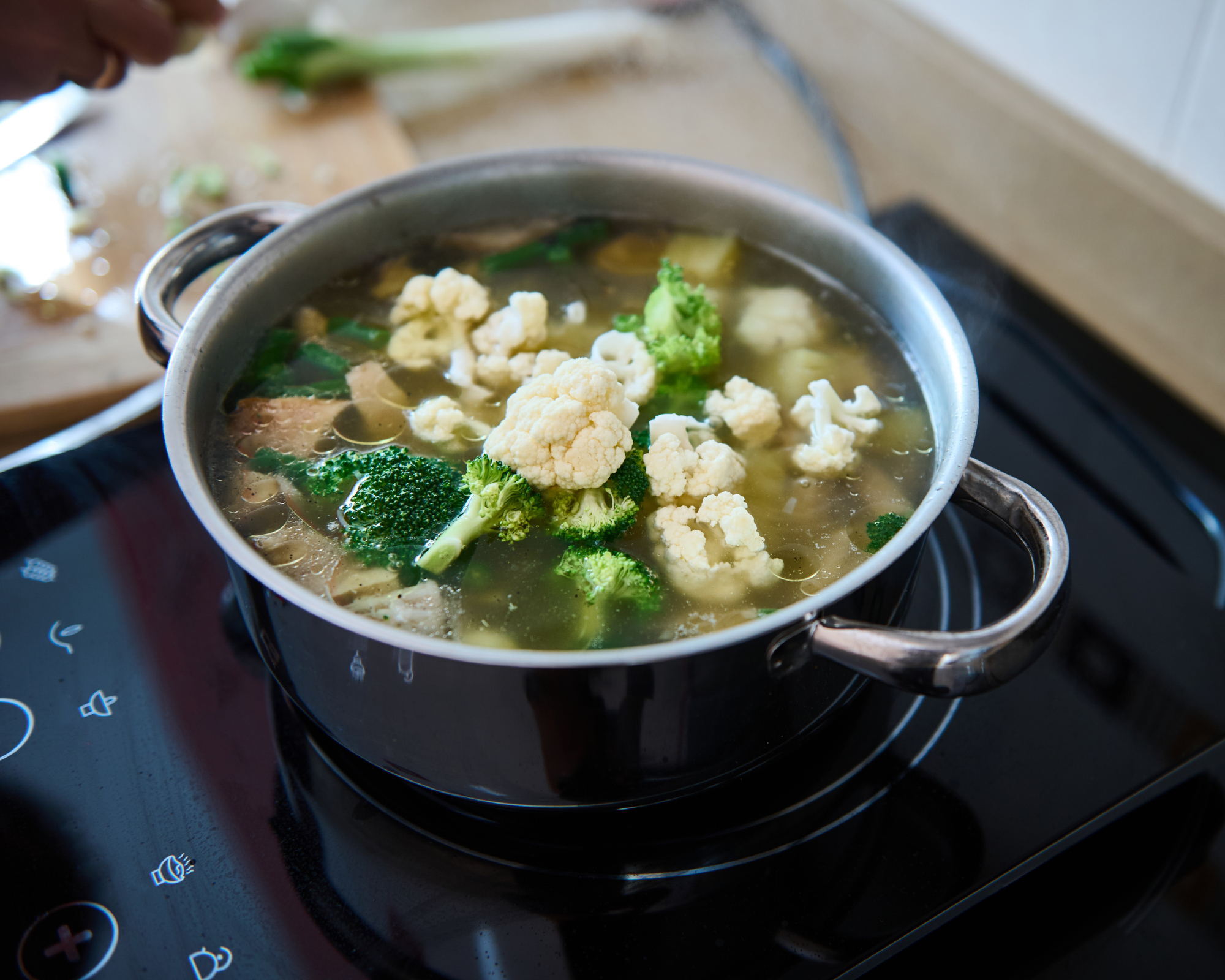 pot of broccoli and cauliflower boiling on a cooktop
