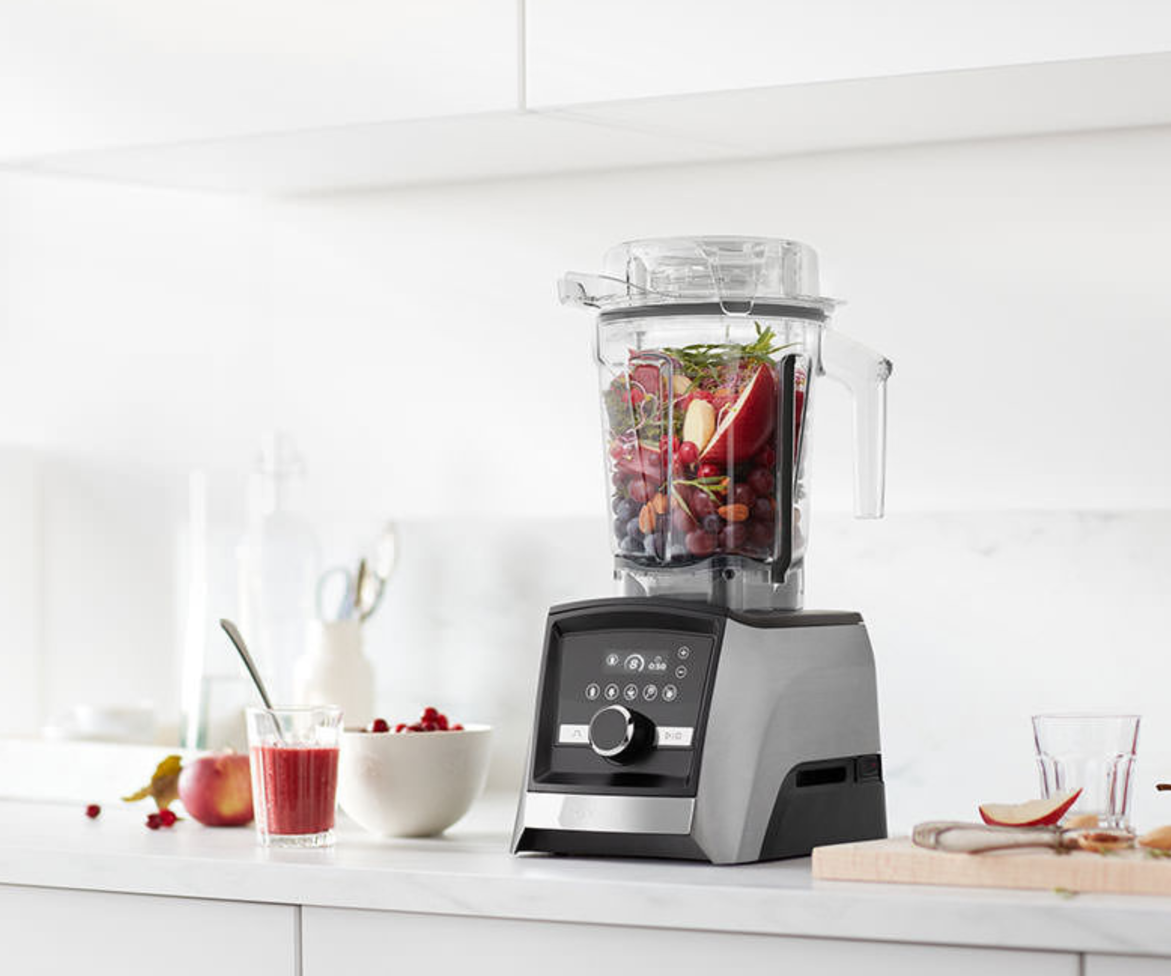 Vitamix A3500 on countertop blending a fruity mix