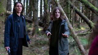 Surrane Jones (L) and Rose Leslie (R) in a forest setting in Vigil season 2