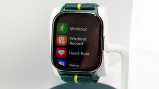 Motorola Watch Fit showing apps screen with Workout, Workout Record, and Heart Rate features
