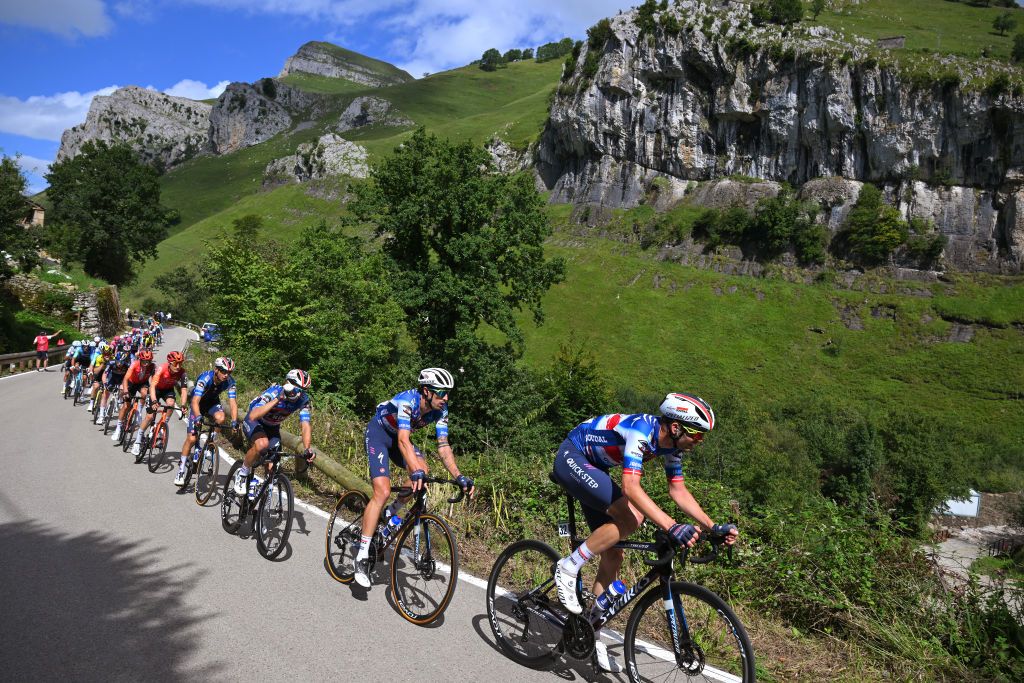 PICON BLANCO BURGOS SPAIN SEPTEMBER 07 LR Mattia Cattaneo of Italy and Kasper Asgreen of Denmark and Team TRex Quick Step lead the peloton during the La Vuelta 79th Tour of Spain 2024 Stage 20 a 172km stage from Villarcayo to Picon Blanco 1491m UCIWT on September 07 2024 in Picon Blanco Burgos Spain Photo by Tim de WaeleGetty Images