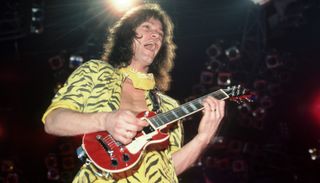 Eddie Van Halen plays a mini Les Paul onstage at the Cobo Arena in Detroit, Michigan on April 6, 1984