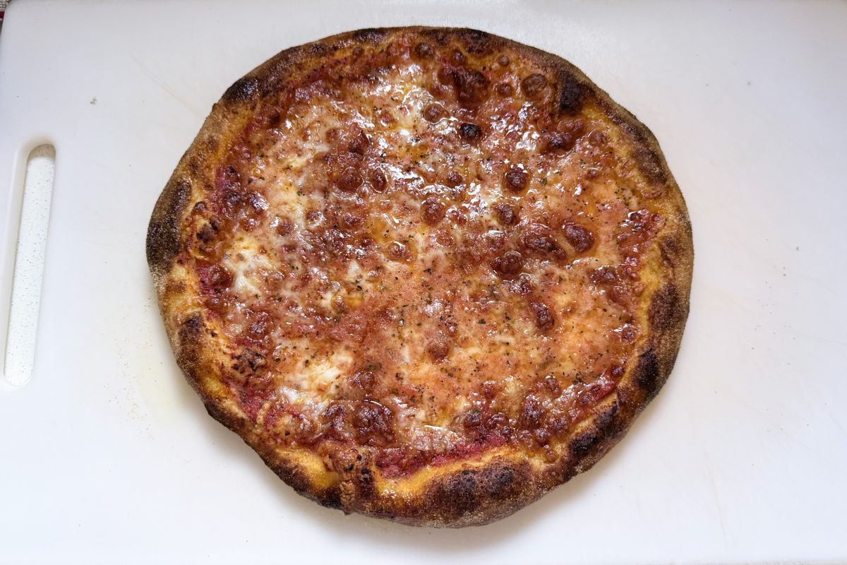 A pizza on a chopping board